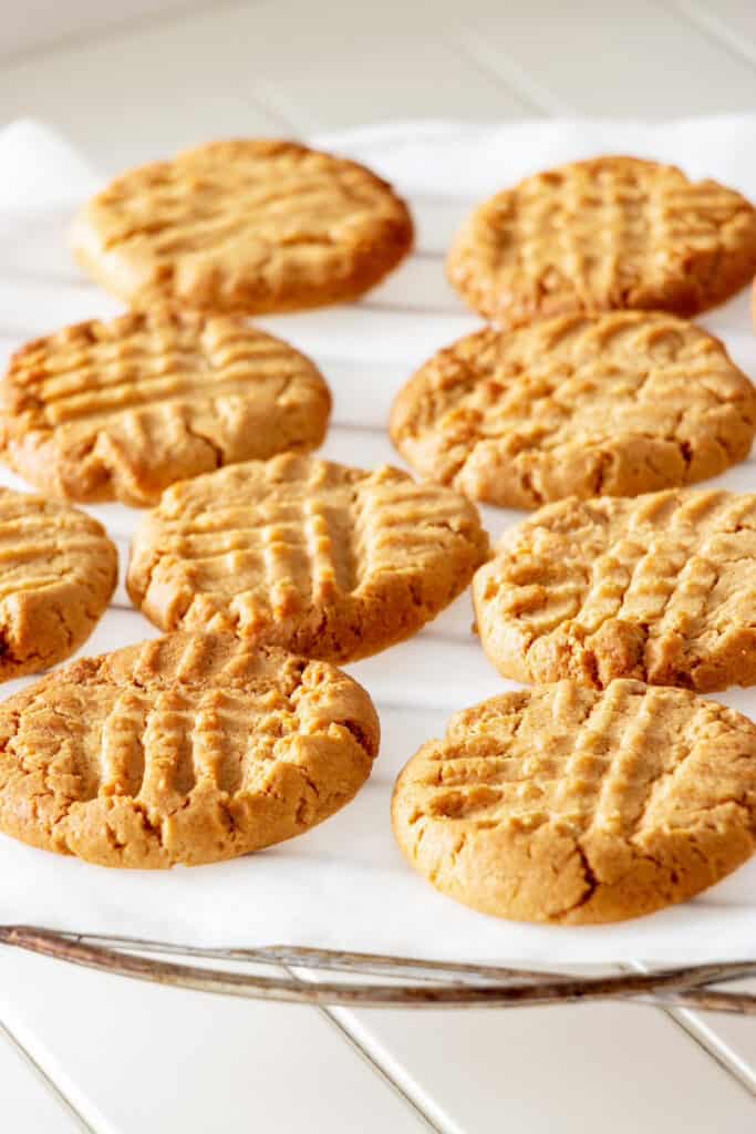 keto peanut butter cookies cooling on a rack