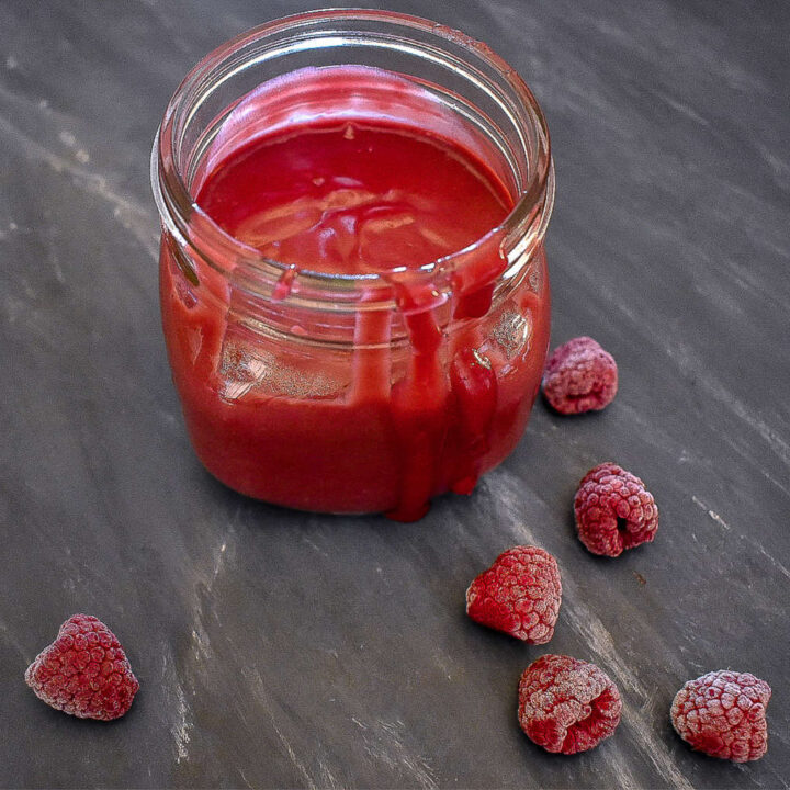 sugar-free raspberry curd in a mason jar