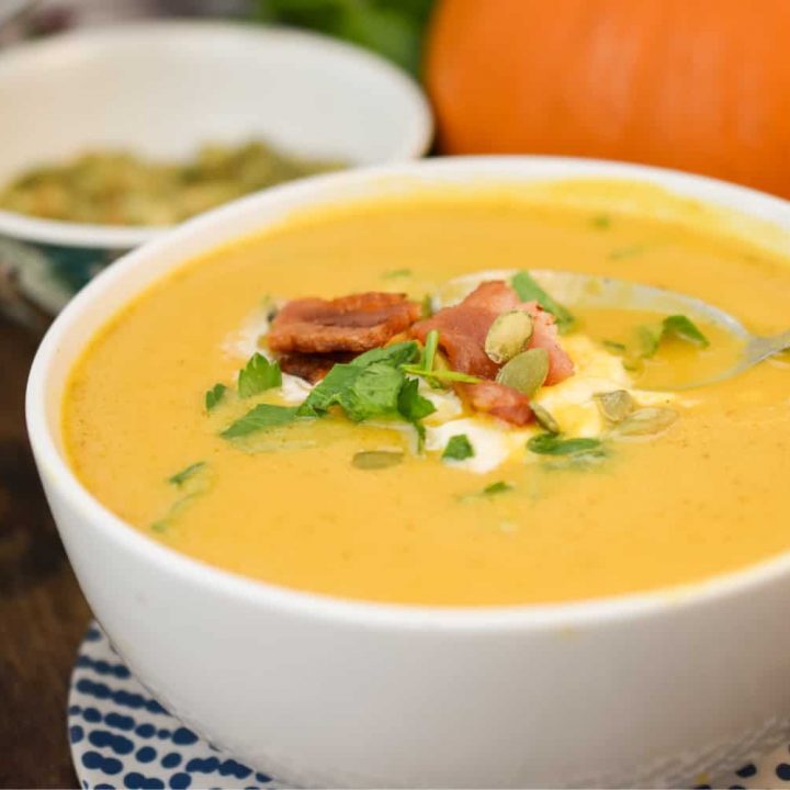 keto pumpkin soup served in a white bowl