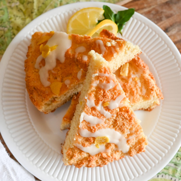 keto lemon scones stacked on a small white plate