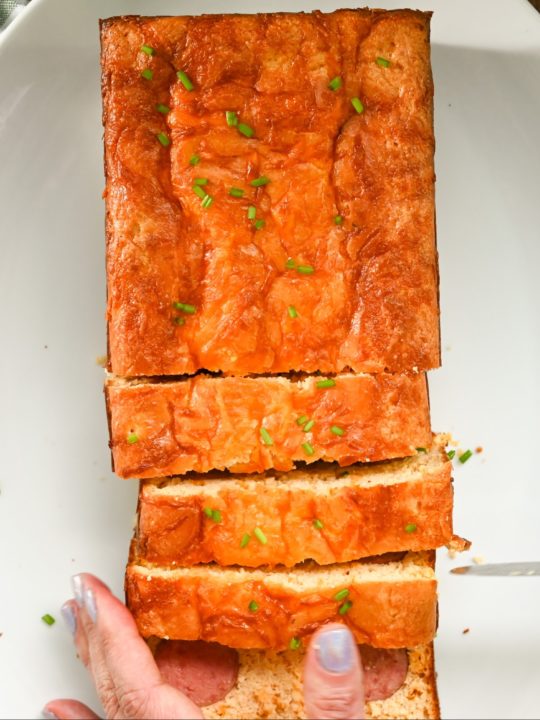 keto kielbasa cornbread loaf being sliced