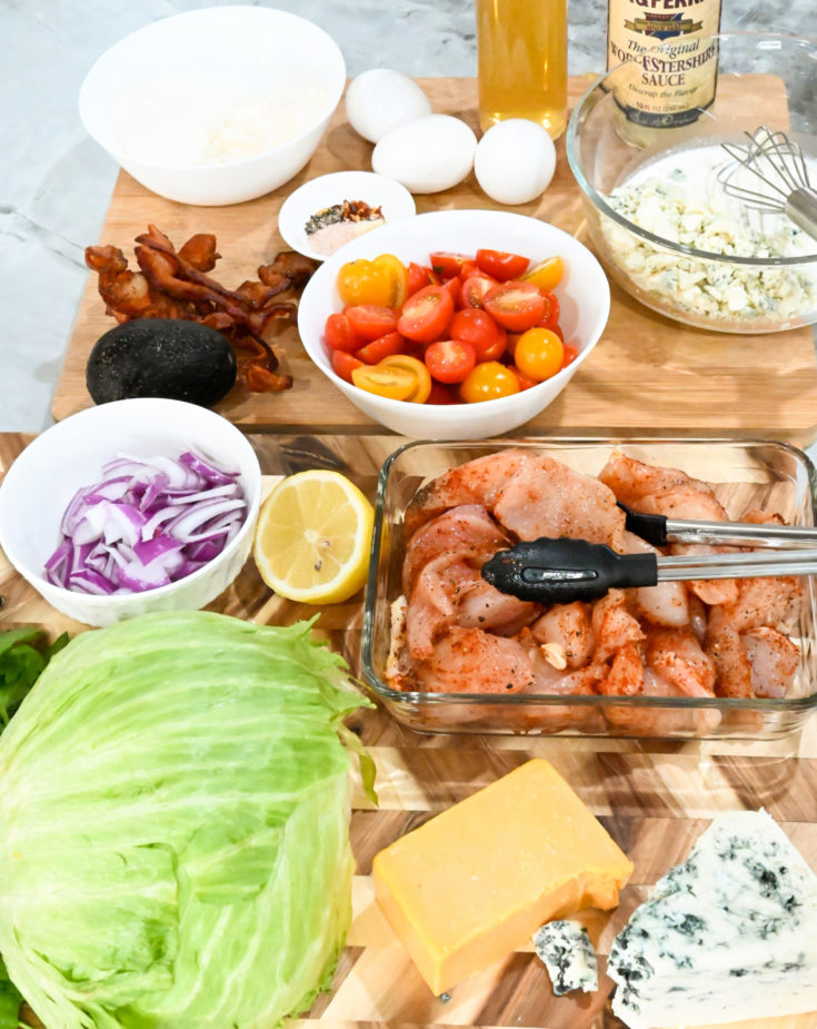 keto Cobb salad ingredients on a wooden board