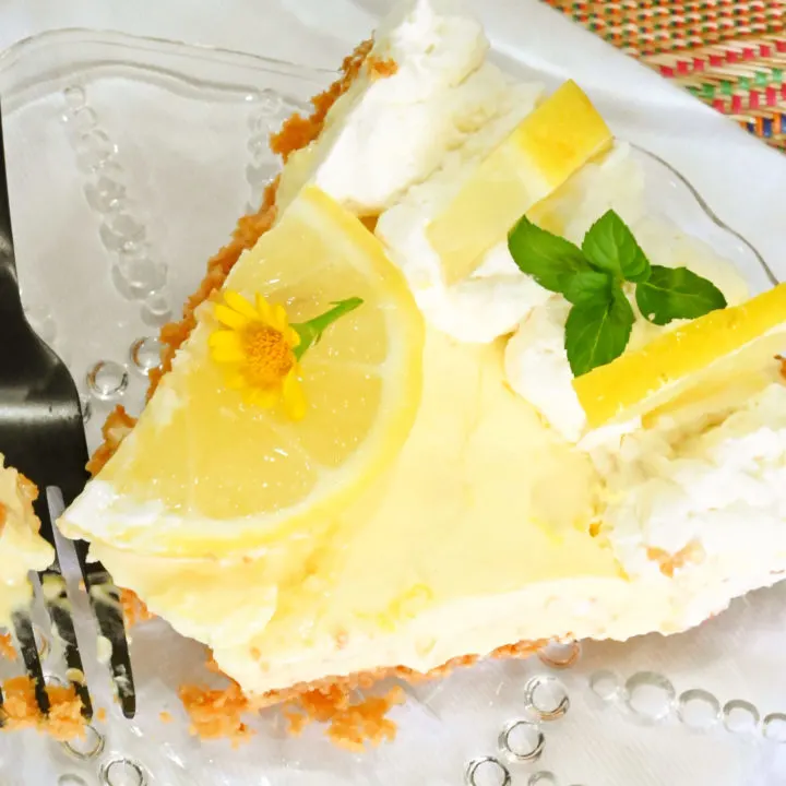 keto sour cream lemon pie slice on a clear plate