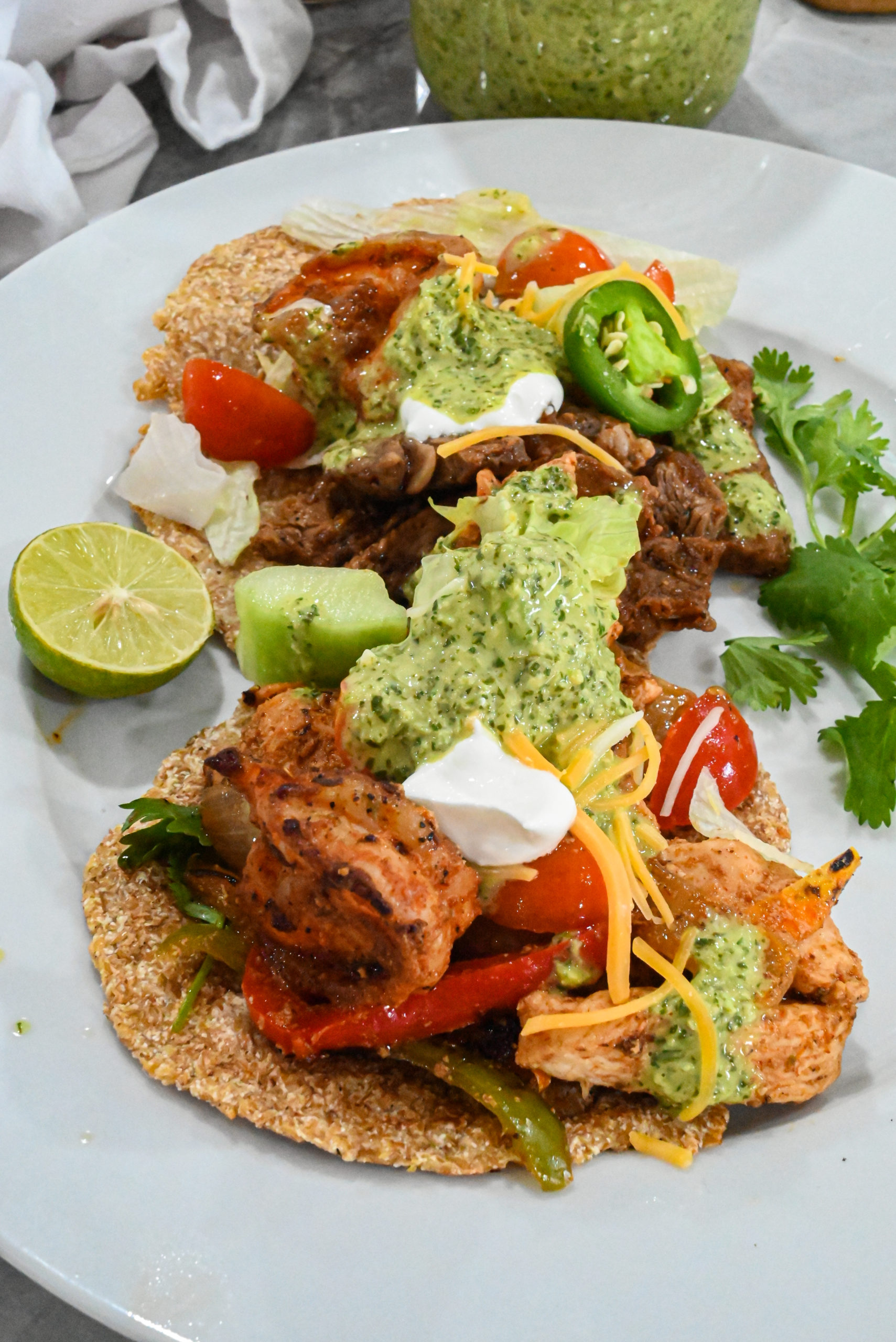 keto tacos with keto spicy cilantro garlic sauce drizzzled on top