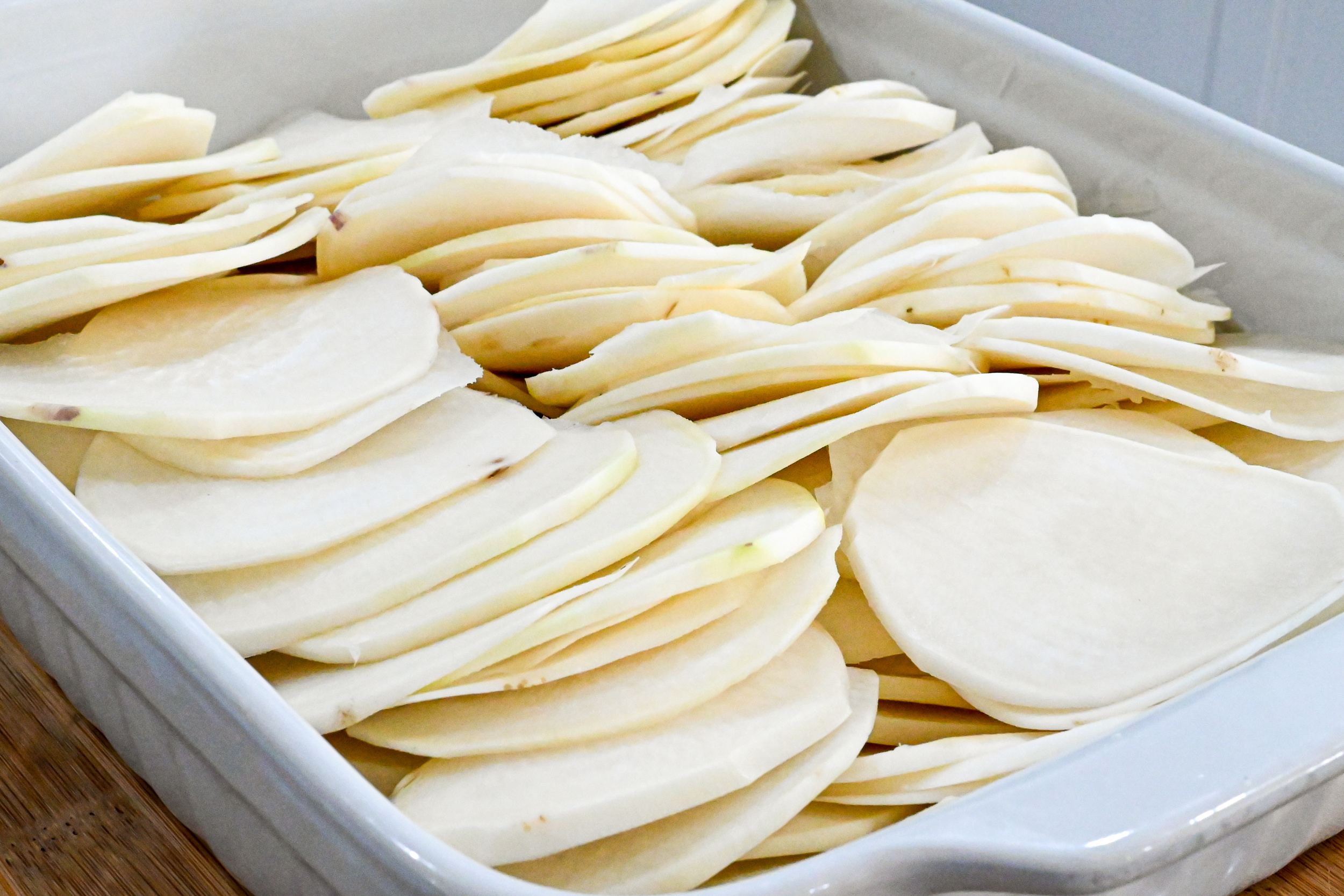 turnips slices in a rectangle baking dish