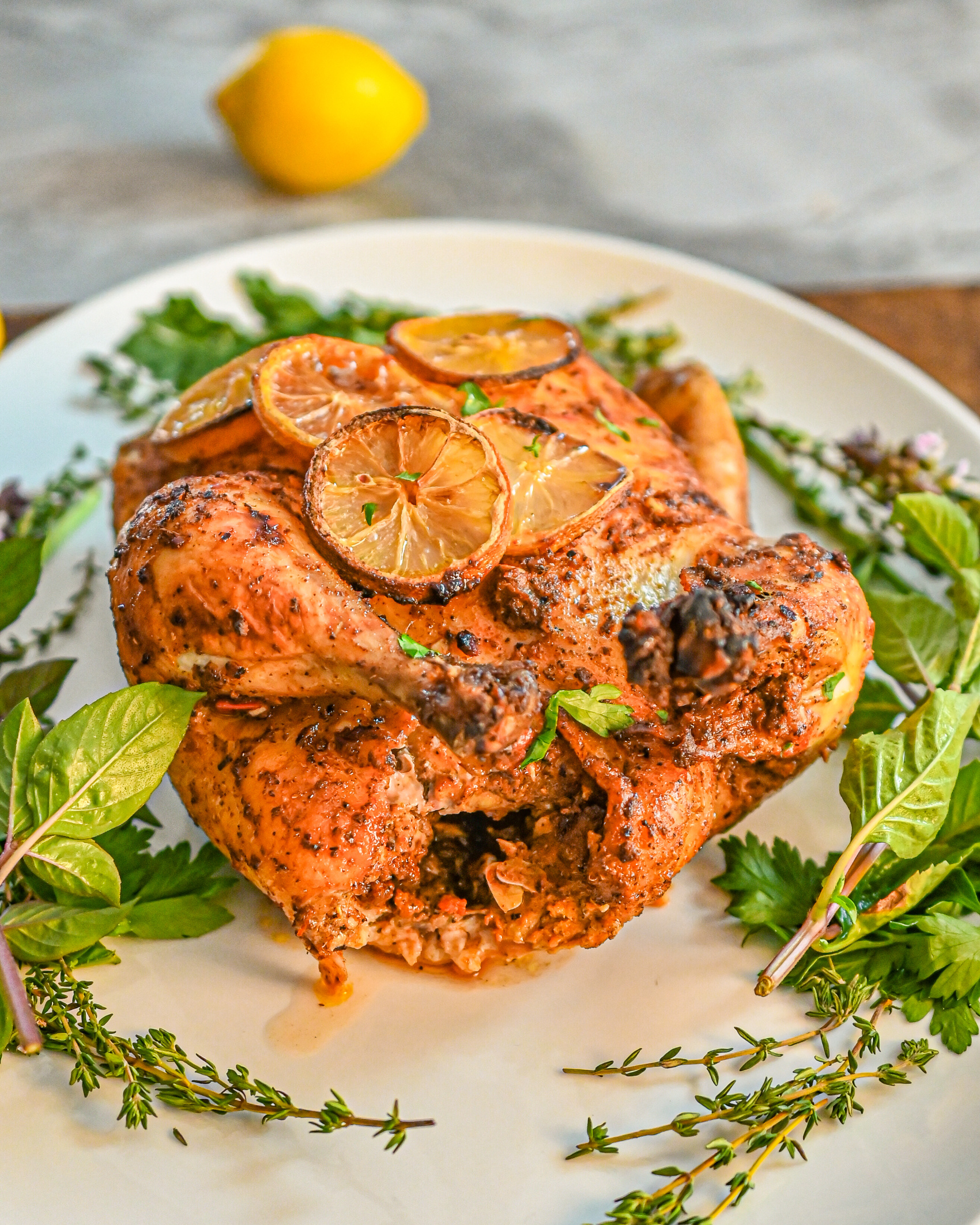 Low carb harissa sumac chicken served on a white platter