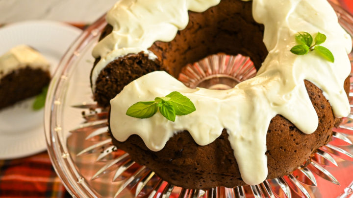 keto chocolate bundt pan on a clear cake stand