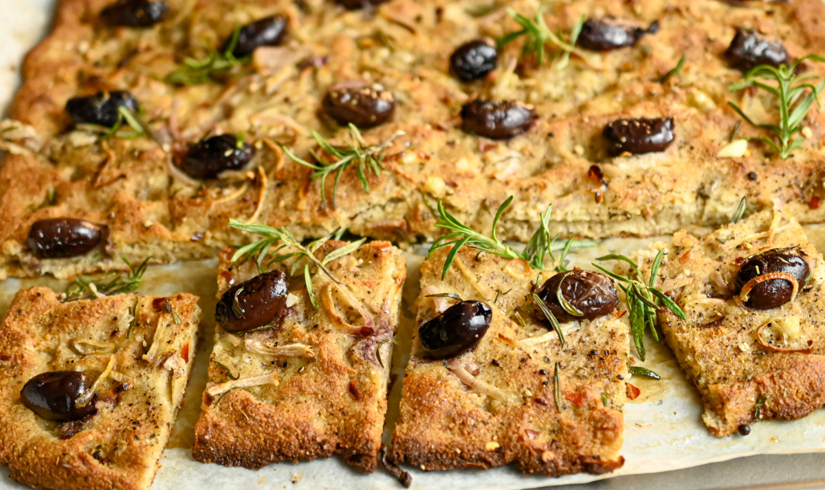 low carb focaccia bread sliced on a baking sheet