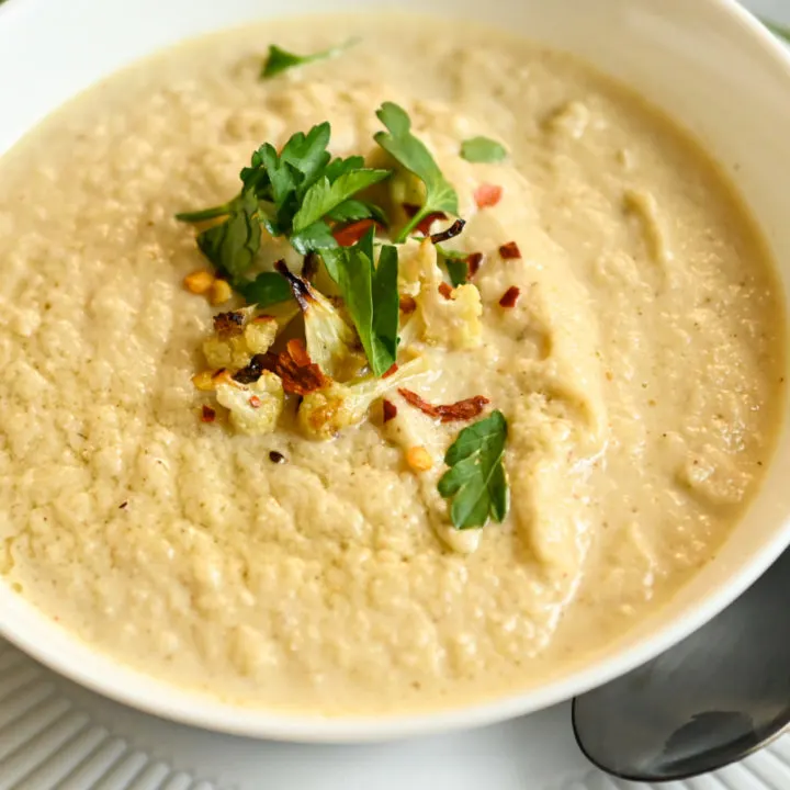 keto roasted cauliflower soup in a white bowl