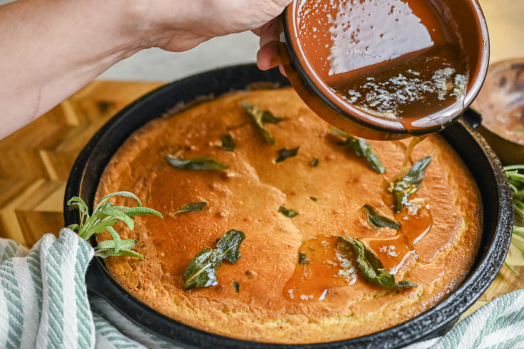 pouring butter over keto brown butter sage cornbread