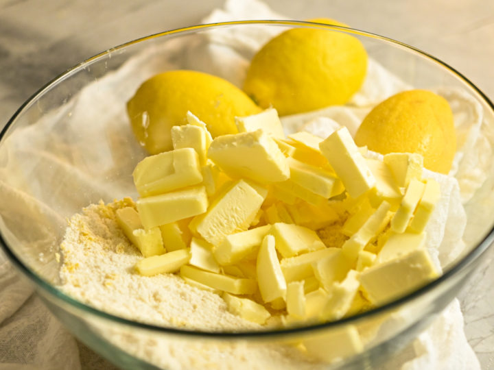 keto-friendly lemon shortbread ingredients in a clear glass bowl ready to be formed