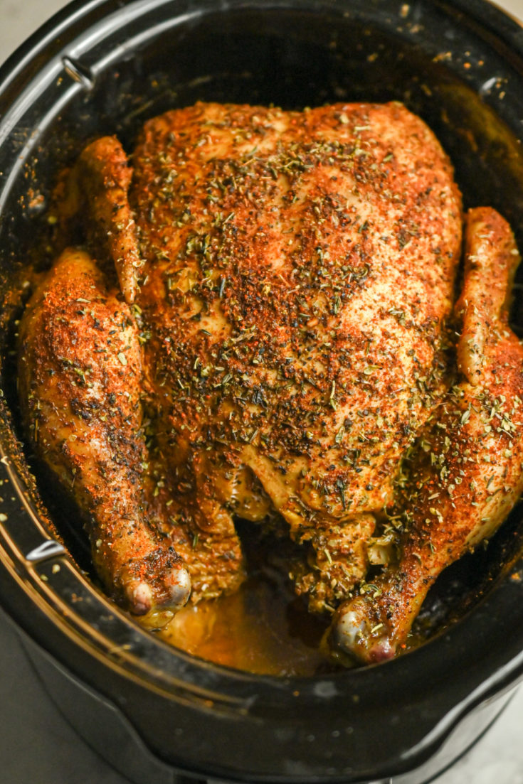 fully cooked whole chicken in a crockpot