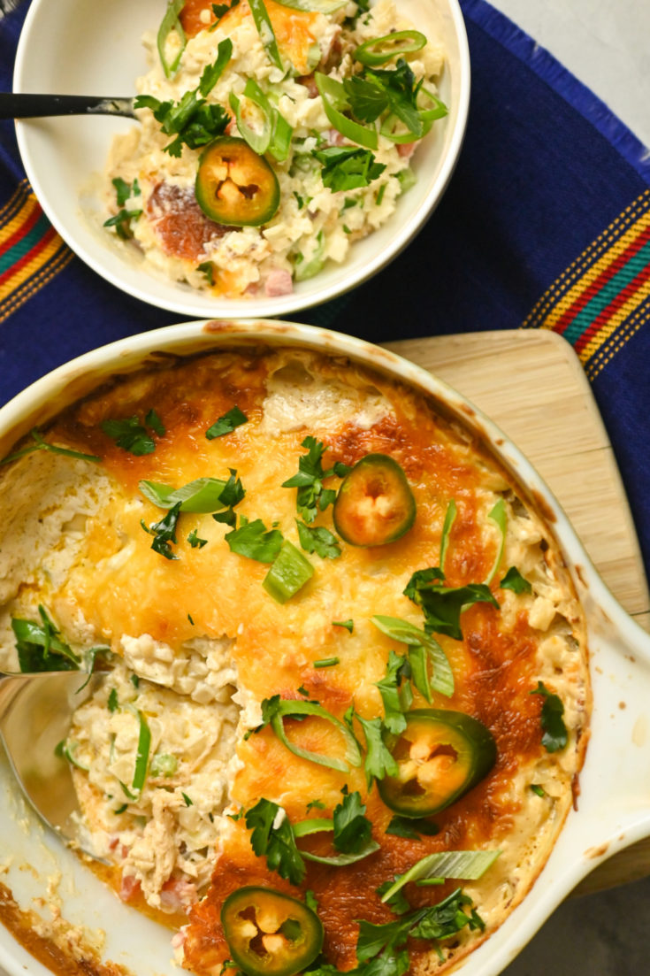 keto Mexican Chicken Casserole baked in a round casserole dish and served in a small white bowl