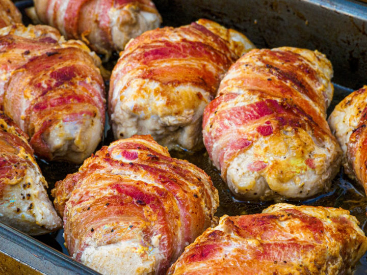 seasoned keto bacon wrapped chicken baked in roasting pan