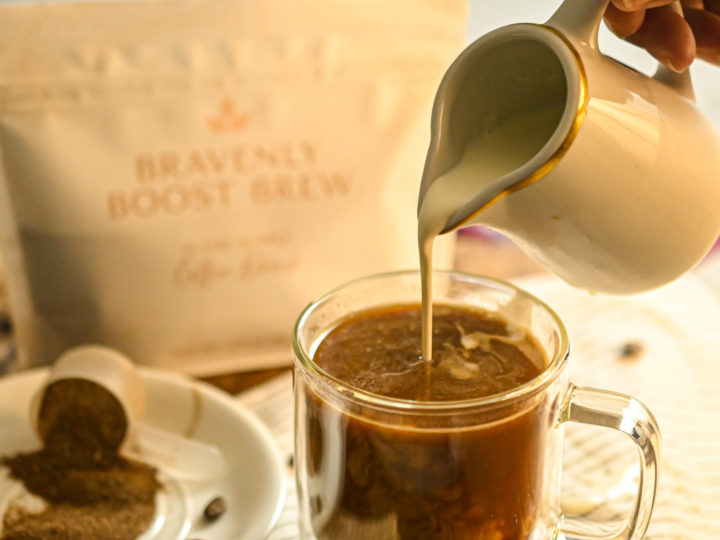 Cream being added to hot mushroom boost coffee