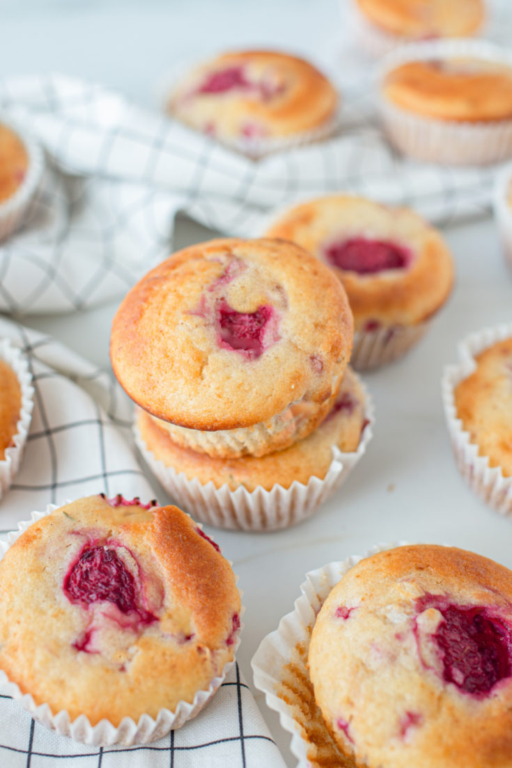 keto coconut flour raspberry muffins on marble counter