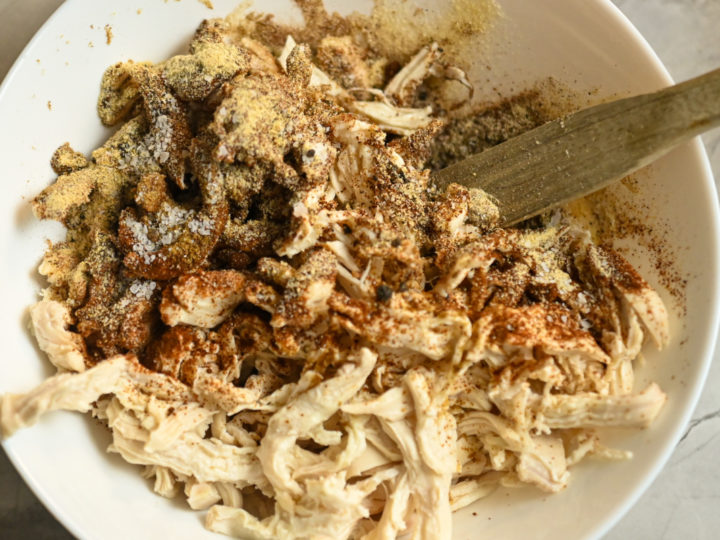 cooked shredded and seasoned chicken