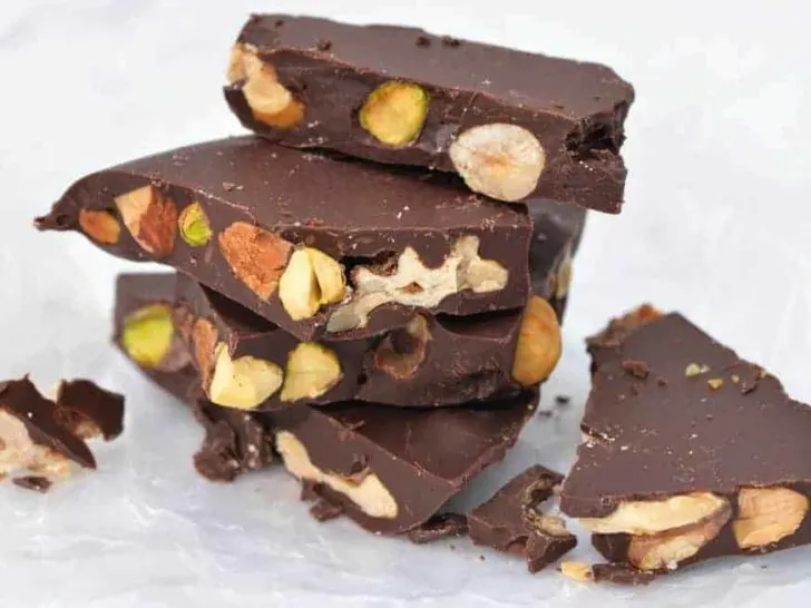 keto chocolate bark with mixed nuts on wax paper