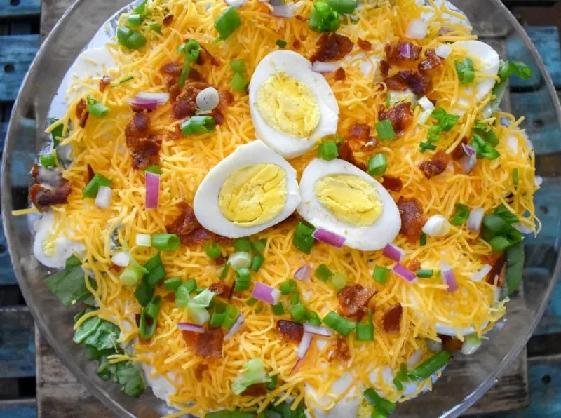 keto 7 layer salad in a clear bowl