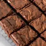 Coconut flour keto brownies on a parchment lined baking rack