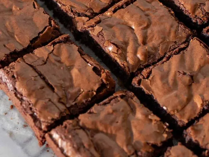 Coconut flour keto brownies on a parchment lined baking rack