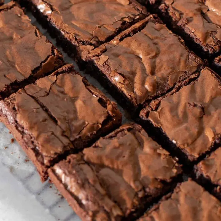 Coconut flour keto brownies on a parchment lined baking rack