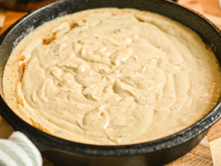 almond flour cornbread batter in a cast-iron skillet ready to bake
