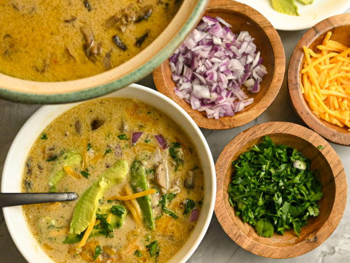 keto cheeseburger soup served with toppings in small wood bowls