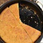 keto cornbread sliced in a cast iron skillet