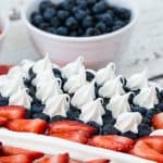 This delicious keto poke cake is decorated to look like an American flag. It's a perfect low carb poke cake for the 4th of July, Memorial Day, and Veterans Day. #ketopokecake #pokecake #lowcarbcake #lowcarbpokecake