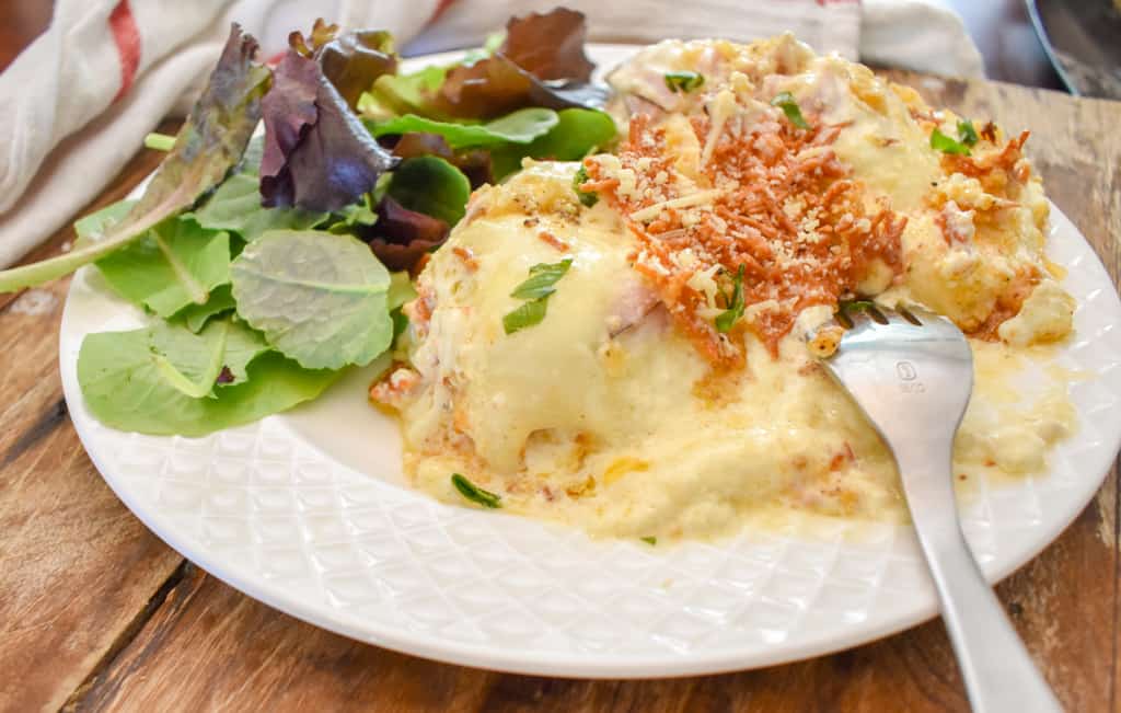 keto chicken cordon bleu casserole served with salad up close