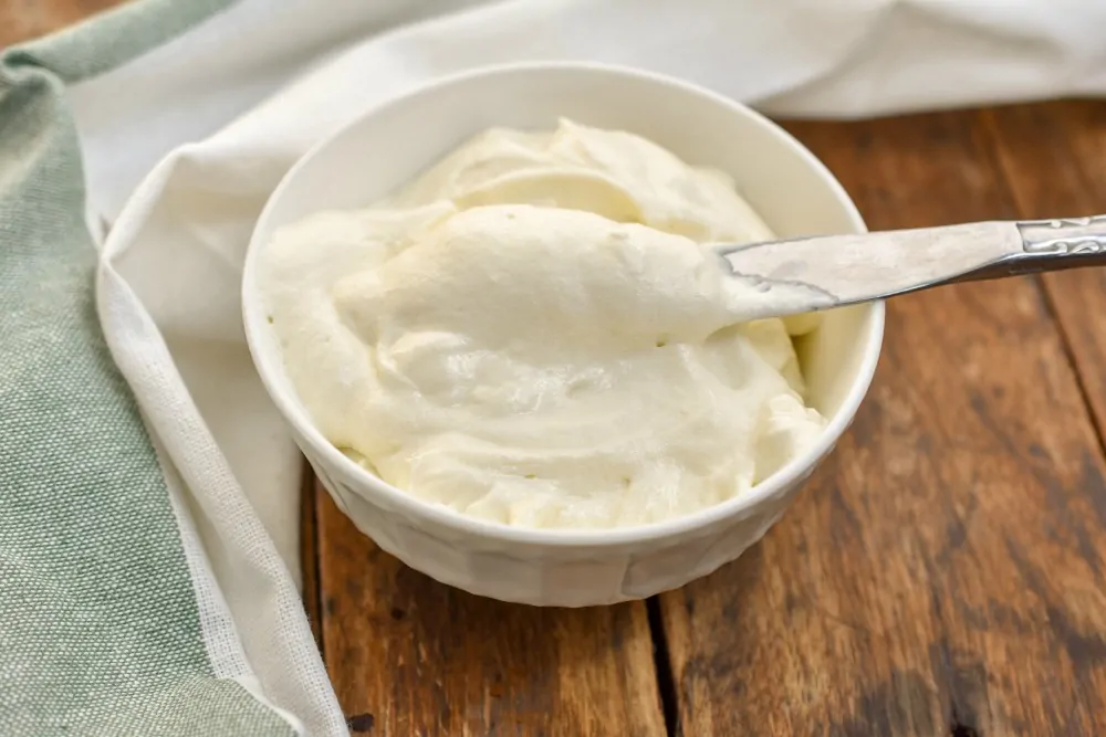 keto cream cheese frosting in a white bowl