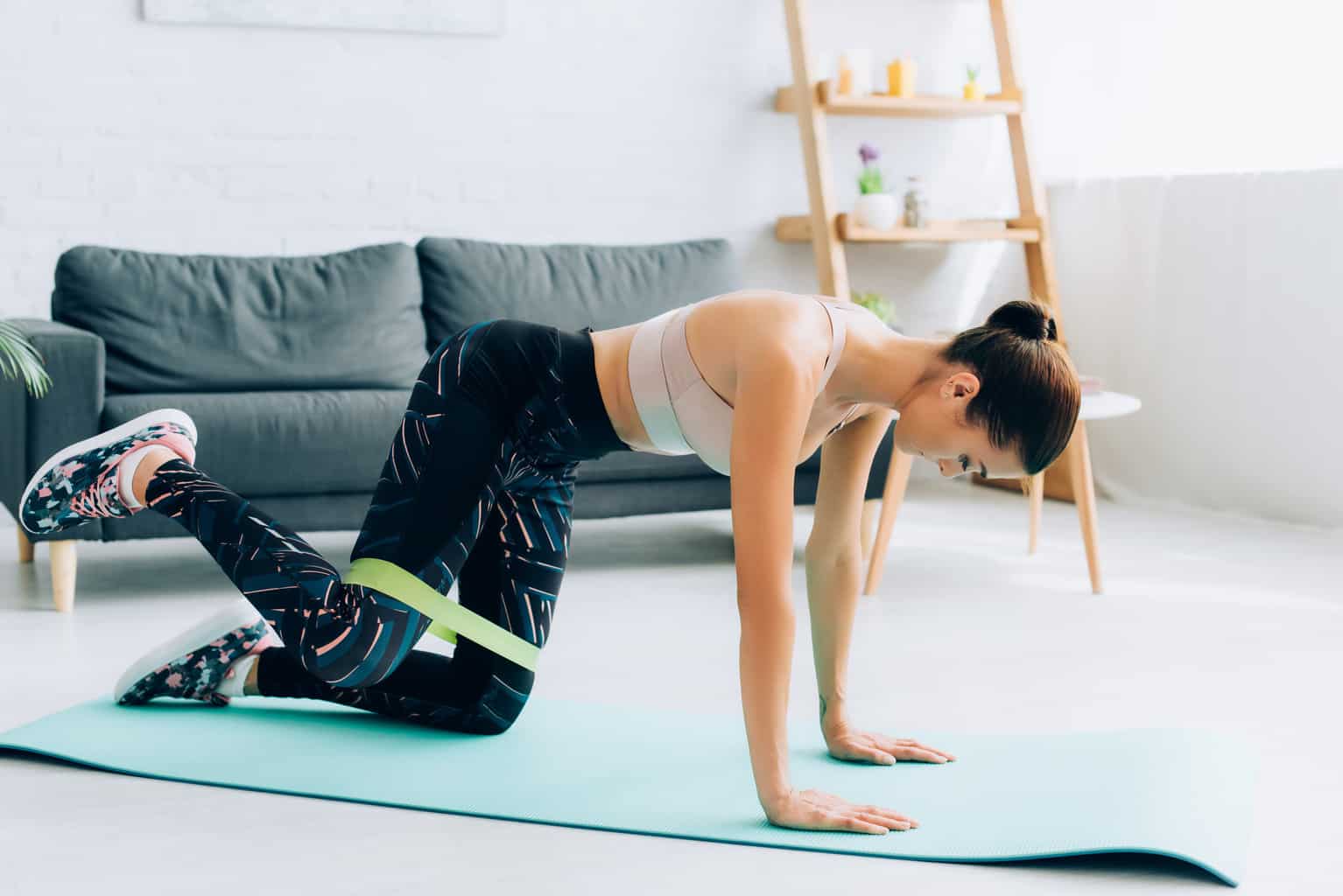 Woman working out at home on mat