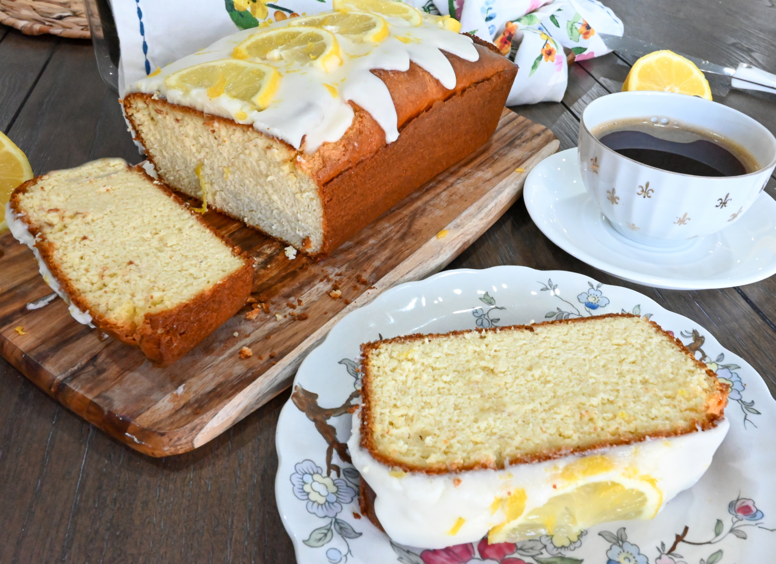 keto lemon pound cake sliced and served on fine china