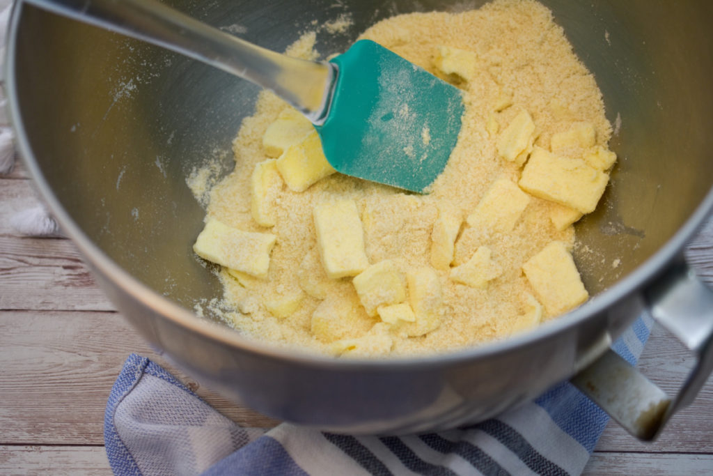 Keto almond flour shortbread dough ingredients added to a mixing bowl