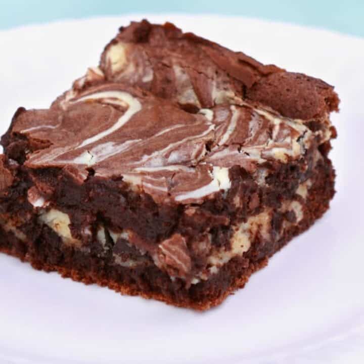 Keto cheesecake swirled brownies to curb your chocolate and cheesecake cravings.