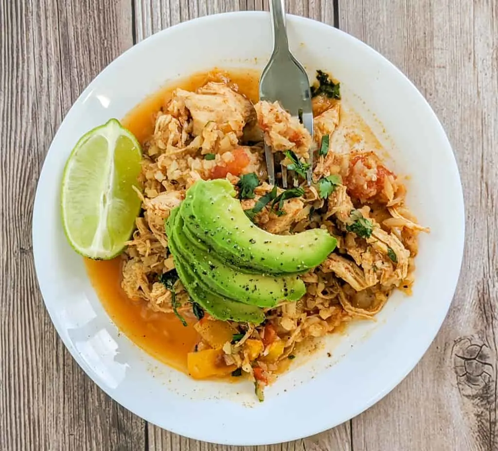 Keto Mexican Cauliflower Rice and Chicken with Lime on White Plate