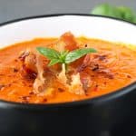 keto tomato bacon and cheddar soup in a black bowl