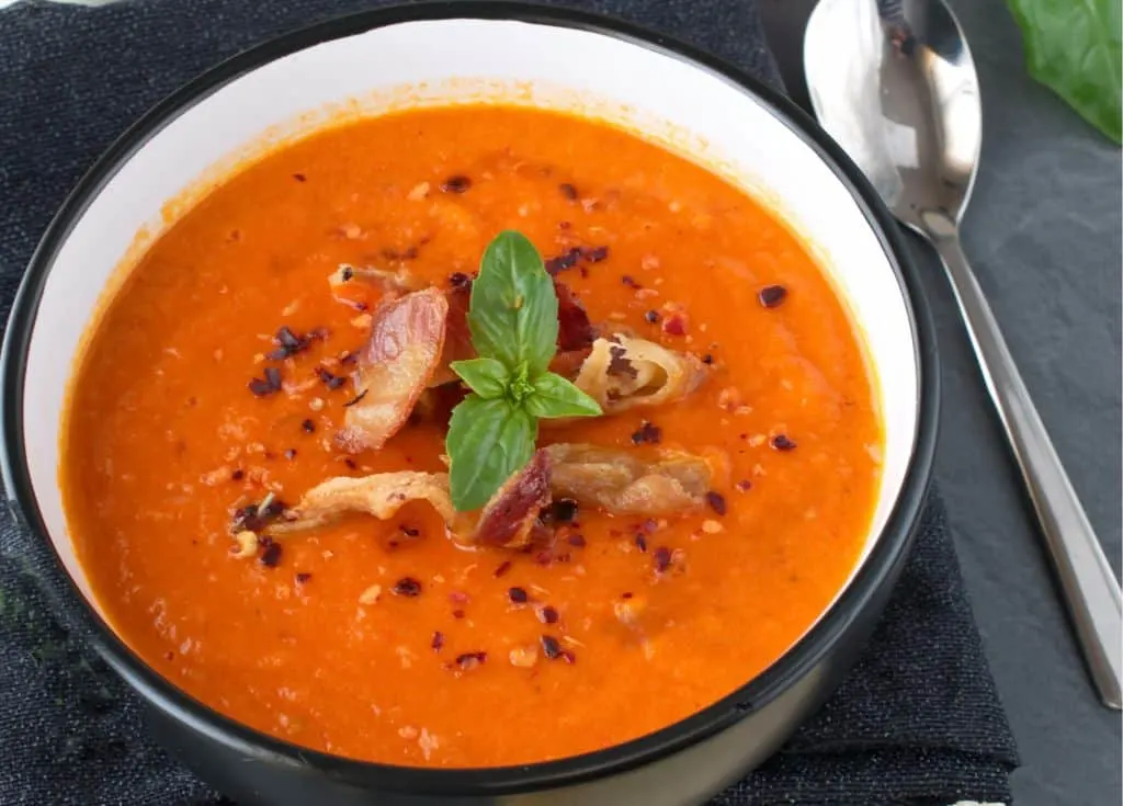 keto tomato bacon cheddar soup in a black and white bowl