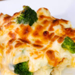 easy keto cauliflower broccoli Mac and cheese on a white plate