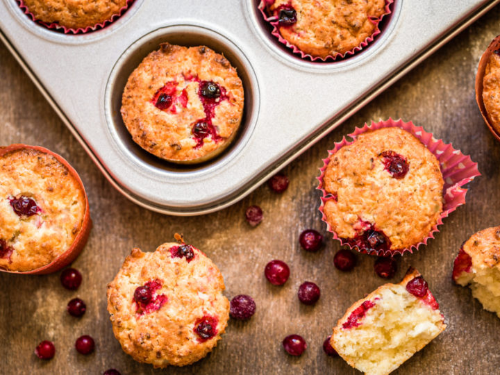 keto cranberry muffins fresh out of a muffin tin