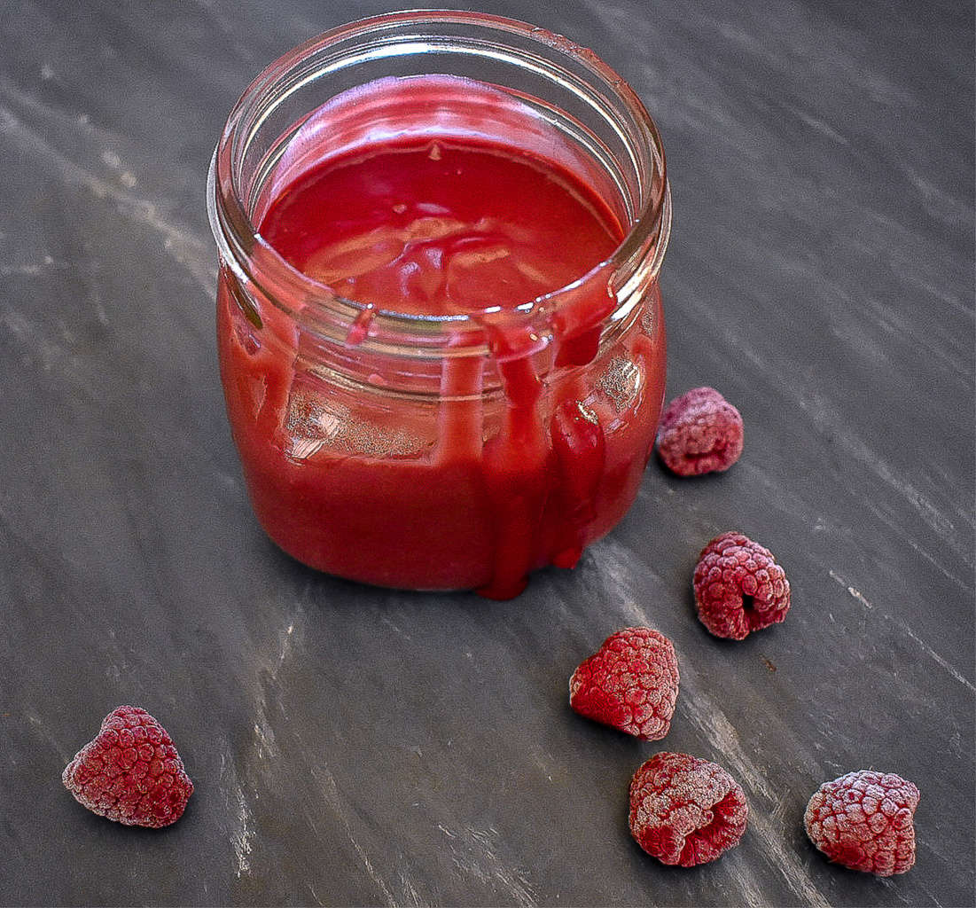 sugar-free raspberry curd in a mason jar