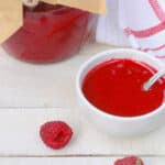 keto raspberry curd sugar-free showing in a mason jar and served in a small dish