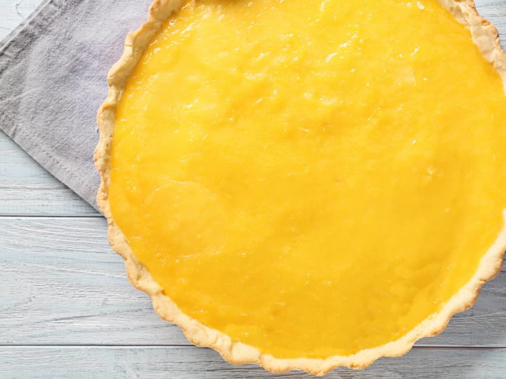 sugar-free lemon curd low carb pie whole on white wood counter