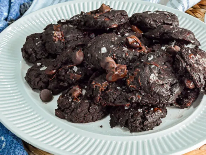keto chocolate flourless cookies with coarse sea salt on a white plate