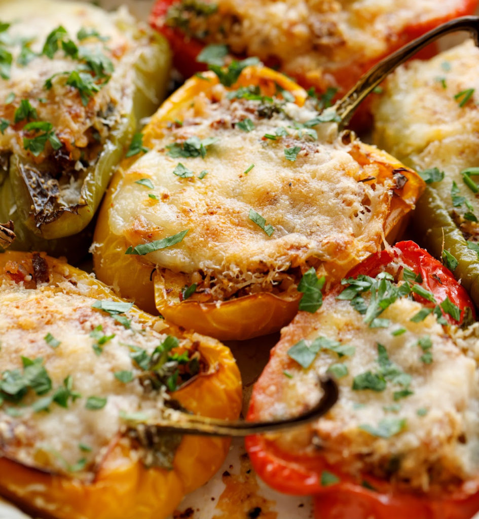 keto Italian multicolored stuffed peppers baked in a white casserole dish