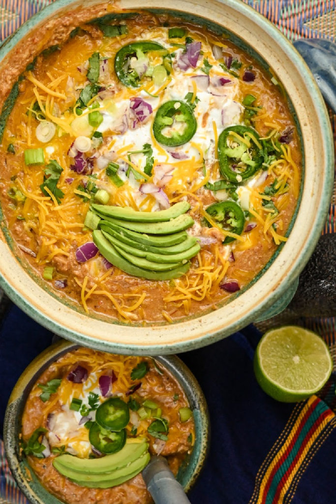 keto-friendly chicken chili easy served on a blue aztec tablecloth