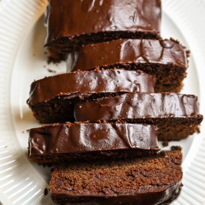 Keto chocolate cream cheese pound cake on a white platter