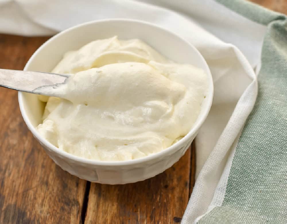 keto cream cheese frosting in a white bowl