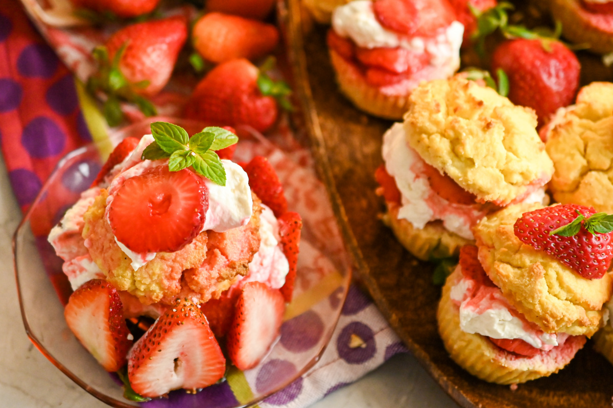 keto strawberry shortcake cupcakes served on a wooden board